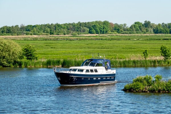 The green countryside of Friesland with boat in the foreground 